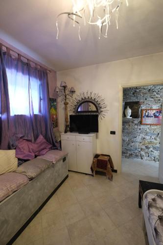 a living room with a bed and a chandelier at Rapallo La Vista by PortofinoVacanze in Rapallo