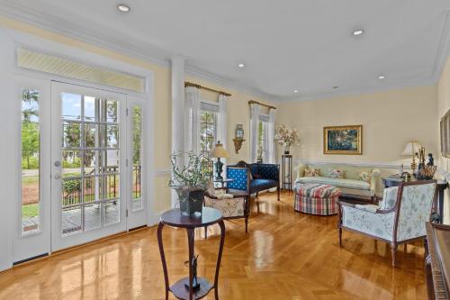 a living room with a couch and a table at Lake Escape - Lake Waccamaw home in Lake Waccamaw