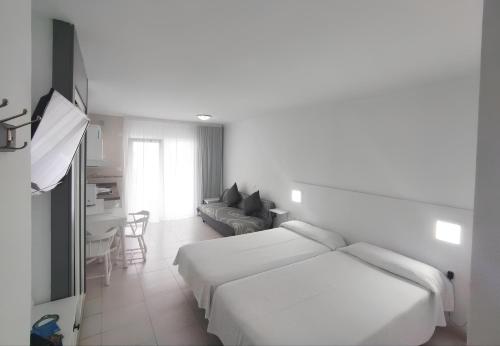 Ένα ή περισσότερα κρεβάτια σε δωμάτιο στο Precioso Estudio hasta 3 pax en Puerto de la Cruz