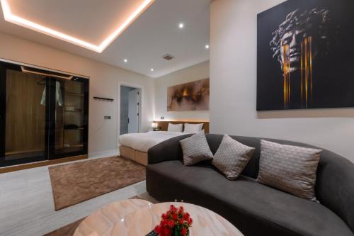 a living room with a couch and a bed at Riyadh Luxury in Riyadh