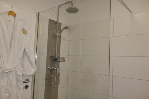Koupelna v ubytování Inselblume 17 - Gemütliche Ferienwohnung mit Meerblick in der Strandburg