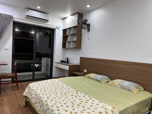 a bedroom with a large bed and a window at An Lạc 402MD in Hanoi