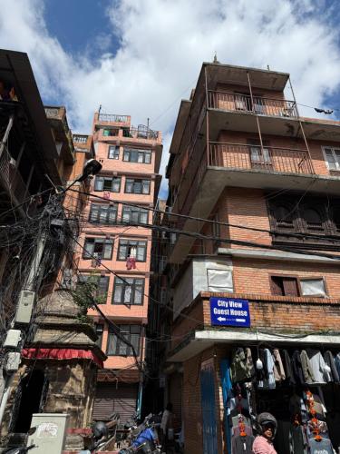 a group of tall buildings on a city street at Cityview Guest House in Kathmandu