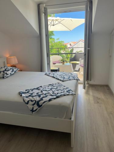 Postel nebo postele na pokoji v ubytování Apartments Duje