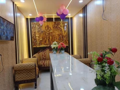 a conference room with a long table and purple balloons at Family Hotel -1 Min Walk in Nizamuddin Railway Station in New Delhi