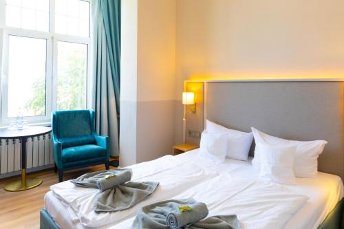 Ένα ή περισσότερα κρεβάτια σε δωμάτιο στο Hotel Germania