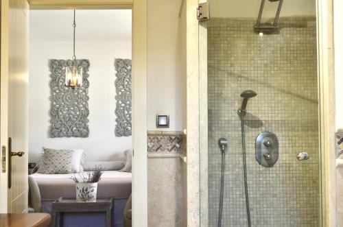 a bathroom with a shower with a glass door at Hotel La Gastrocasa - Adults Only in Gandía