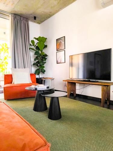 a living room with a large flat screen tv at Bridge House 301-3BR Penthouse in Limassol
