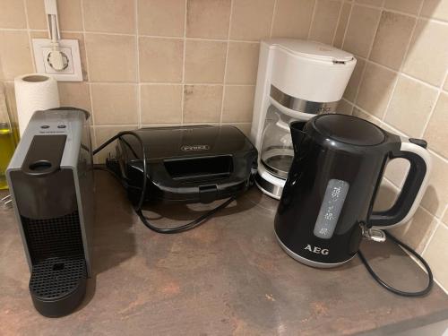 a kitchen counter with a coffee maker and a toaster at Athens City Hub in Athens