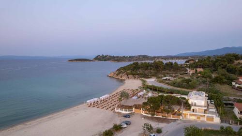an aerial view of a beach with a resort at Linari Sea & Suites in Ormos Panagias