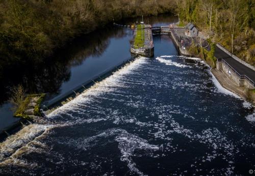 an aerial view of a canal with water at The Residence at Lough Key - Luxury by the Water in Knockvicar Bridge