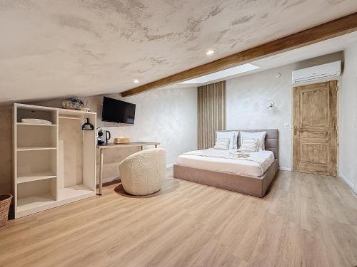 Postel nebo postele na pokoji v ubytování L'Oliveraie d'Eurocentre - Piscine et Spa - Paradis des enfants