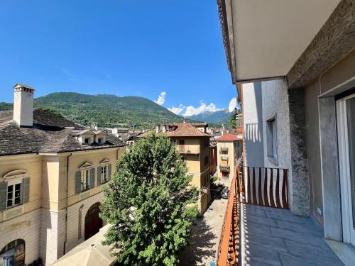 a view of a city from a balcony with a christmas tree at Dimora Francesco in Domodossola
