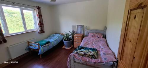Ένα ή περισσότερα κρεβάτια σε δωμάτιο στο Lavender Hill Guesthouse