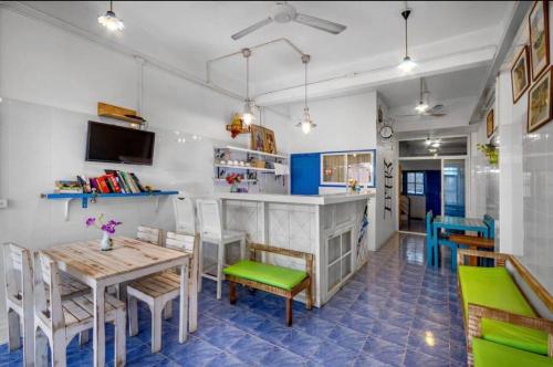a dining room with a table and chairs at La Casa Residencies in Patong Beach