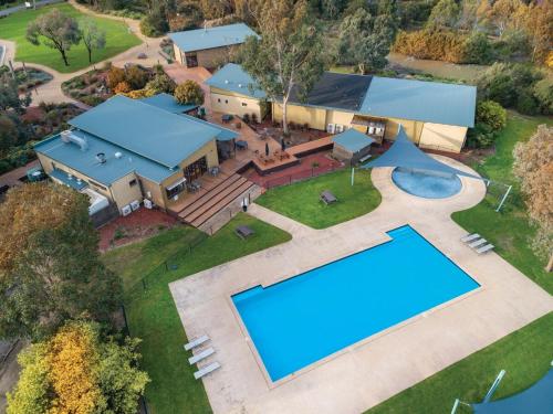 an aerial view of a house with a swimming pool at Superior Poolside Retreat Resort in Cowes