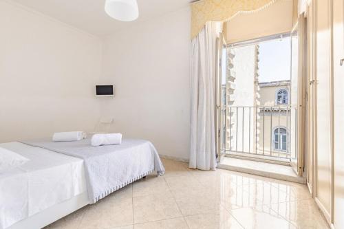 A bed or beds in a room at Anema e Core