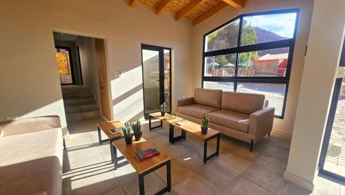 Et opholdsområde på Los Olivos Purmamarca - Cabañas Boutique