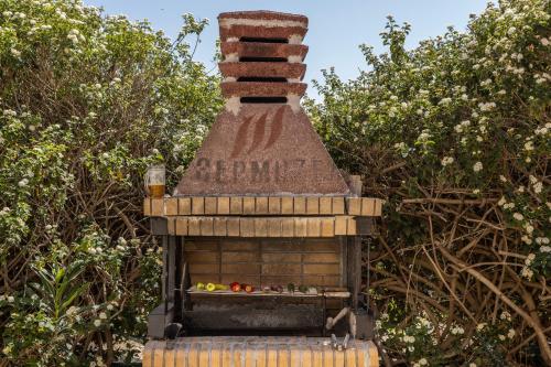 a bird house with some vegetables in it at Villa Tsikkos Dio in Limassol