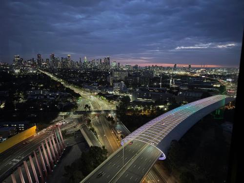 a view of a city at night with a bridge at Top-Floor 2BR Apt, 270 deg Skyline, Free Parking in Melbourne
