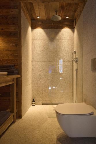 a bathroom with a tub and a toilet in a room at Luxury apartment in Valtournenche in Valtournenche