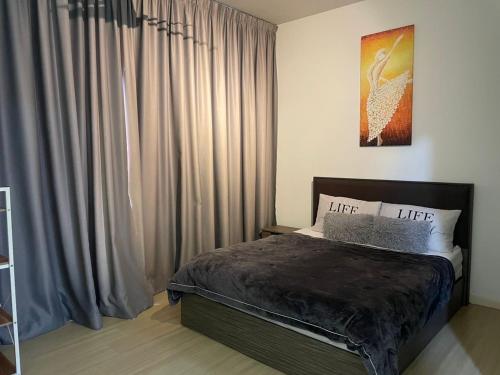 a bedroom with a bed and a large window at Woodsbury Suites Butterworth in Butterworth