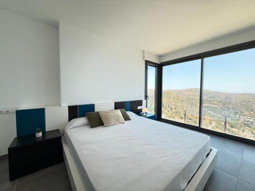 Ένα ή περισσότερα κρεβάτια σε δωμάτιο στο Agi Canyelles Mar