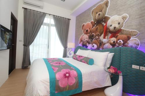 a bedroom with a bed with a bunch of stuffed animals on it at Teamilu Homestay in Datong