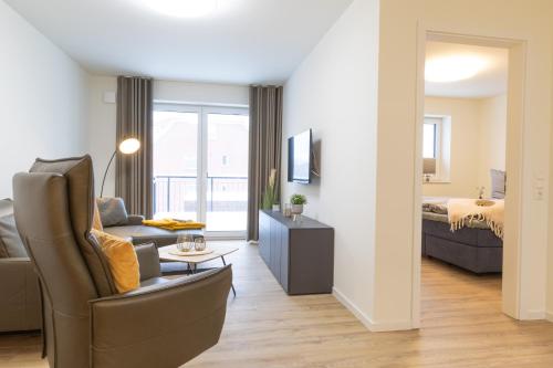 Postel nebo postele na pokoji v ubytování Dorumer Sielhuss 11 mit Sauna und Balkon