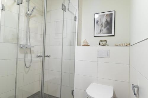 Koupelna v ubytování Ferienwohnung Hyggelig - Strandnah mit Sauna und Balkon