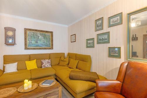 a living room with a couch and a table at Ferienwohnung Roswitha am Park in Bad Orb