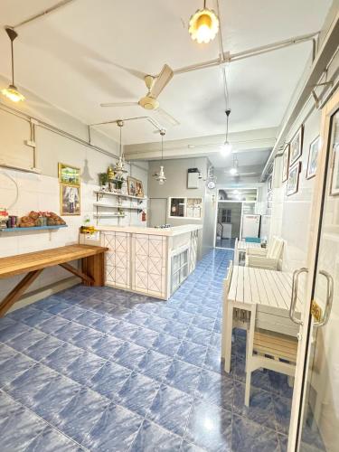 a kitchen with a table and a dining room at La Casa Residencies in Patong Beach