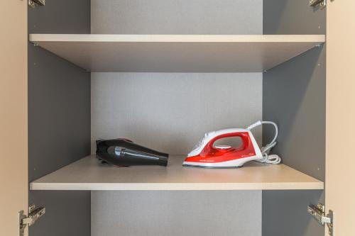 a pair of scissors and a pen on a shelf at CityZen - Boutique Studios in Achrafieh in Beirut
