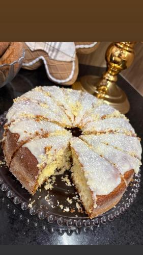 a cake sitting on a plate on a table at Hotel Ferrari in Rio do Sul