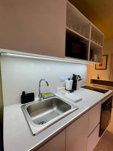 a kitchen with a sink and a counter top at Foster Studio - Park in Buenos Aires