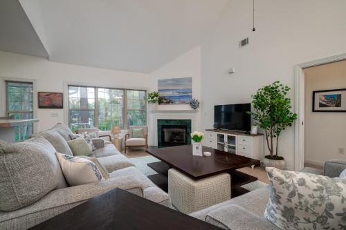a living room with a couch and a table at 2882 Old Drake in Seabrook Island