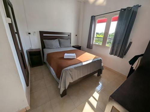 Postel nebo postele na pokoji v ubytování Hotel Arda Bali