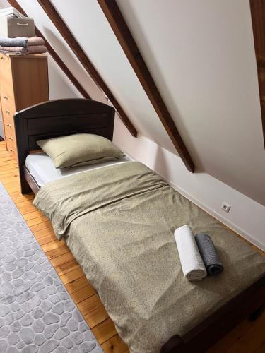 a small bed in a room with at Holiday Home UnaPark in Krakovo