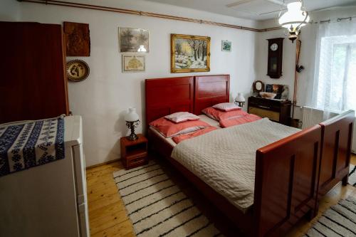 Una cama o camas en una habitación de Németh Tanya Vendégház
