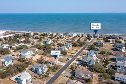 an aerial view of a beach area with houses and the ocean at Now Youre Cookin in Duck