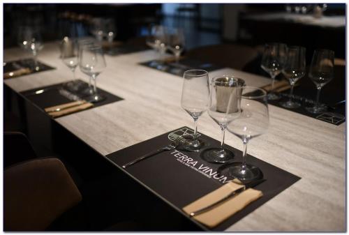 a table with wine glasses and a napkin on it at Terra Vinum in Neméa