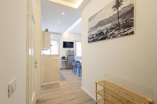 a hallway with a living room with a painting on the wall at Femi Blue in Bordighera