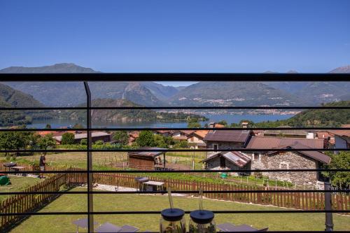 a view from a balcony of a house with mountains at Villa Vento in Colico