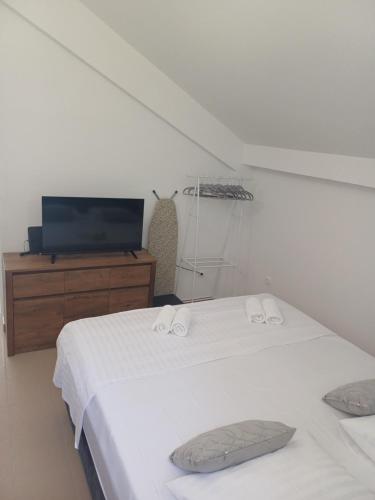 Ένα ή περισσότερα κρεβάτια σε δωμάτιο στο Seaview apartment Lukić