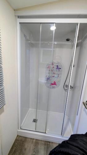a shower with a glass door in a bathroom at 13 The Avenue in Tattershall