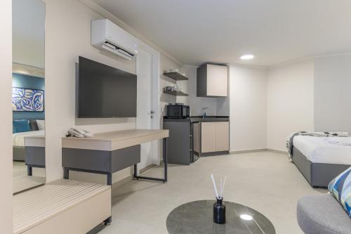 a small living room with a bed and a kitchen at CityZen - Boutique Studios in Achrafieh in Beirut