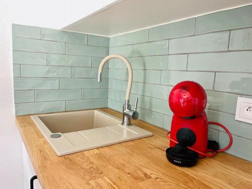 a kitchen with a sink with a mixer on a counter at F3Sun CASA JACOB - 2 BR, Green Oasis, Costa Calma, Fuerteventura in Costa Calma