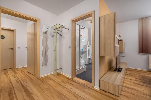 a room with two sliding doors and a hallway at EINFACH SCHÖN Ferienwohnungen in Kurort Oberwiesenthal