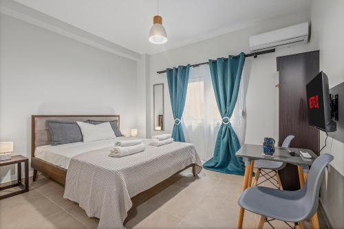 a bedroom with a bed and a blue curtain at Athens Urban Lifestyle Apartments in Athens