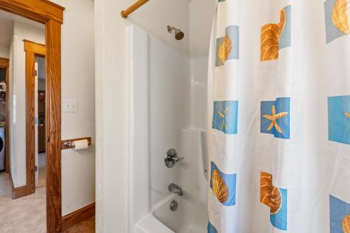 a bathroom with a shower with a shower curtain at Oceans 11 in Salvo